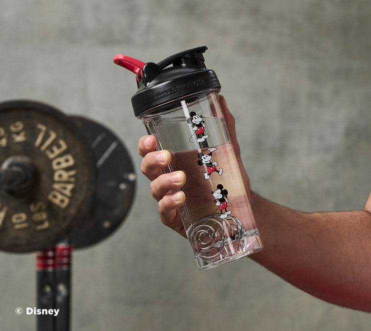 pro-series-c7 Mickey_Mouse_Protein_Shaker_Bottle_Being_Held_In_the_Gym.jpg